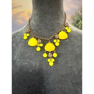 yellow statement bib with rhinestone gold tone